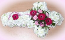 Cross shaped wreath in white and pinks - click to enlarge